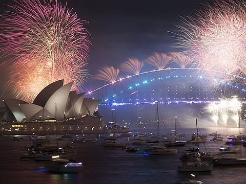 Fireworks by the Sydney Opera House and Sydney Harbour Bridge during New Year celebrations in Sydney, Australia, early on Saturday, January 1, 2022.