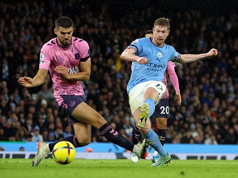 Manchester City's Kevin De Bruyne (right) shoots at goal as Everton's Conor Coady tries to block during their Premier League clash at the Etihad Stadium, Manchester, England.
