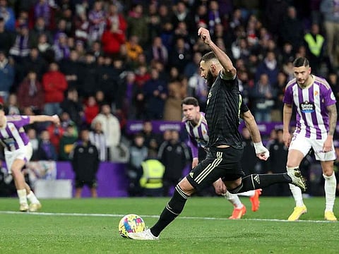 Real Madrid's Karim Benzema scores their first goal from the penalty spot against Valladolid