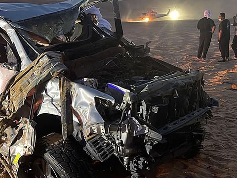 A damaged vehicle after the collision in the desert.