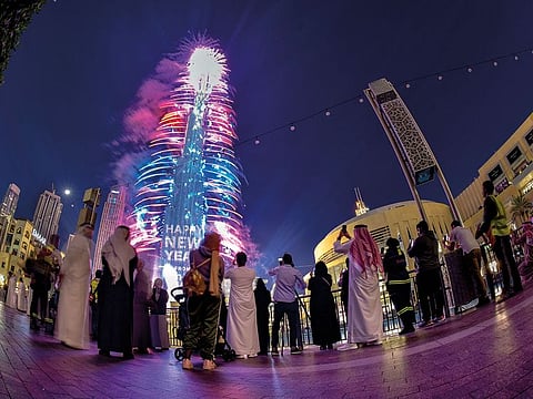 People watch the Burj Khalifa fireworks.