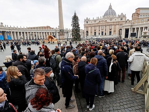 Faithful queue to enter St. Peter’s Basilica to pay homage to former Pope Benedict at the Vatican, January 2, 2023.