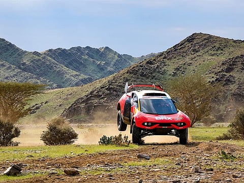 Sebastien Loeb and Fabian Lurquin slipped from second place overnight, just ten seconds off the lead, to 26th in provisional results following a long enforced halt in the desert.