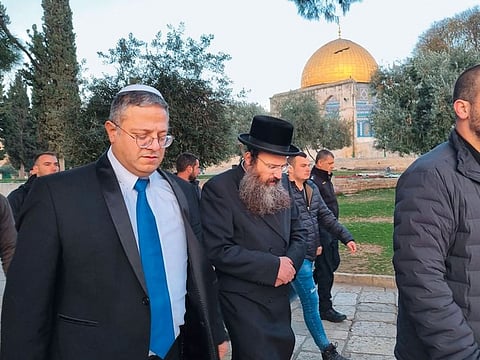 Israeli minister Itamar Ben-Gvir walks past the Dome of the Rock at Haram Al Sharif, which also houses Al Aqsa Mosque, in Jerusalem.