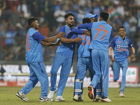 Indian players celebrate a dismissal during the 1st T20 match against Sri Lanka in the Sri Lanka tour of India 2023, at Wankhede Stadium, in Mumbai.