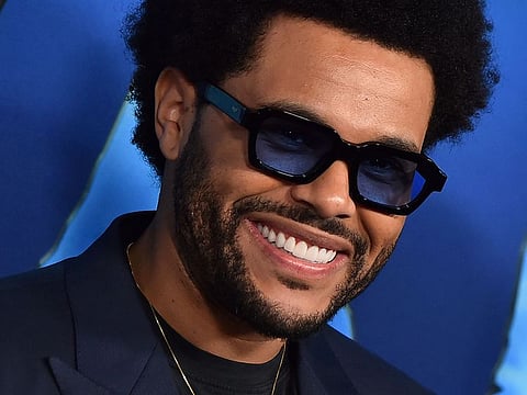 The Weeknd arrives at the US premiere of "Avatar: The Way of Water," Monday, Dec. 12, 2022, in Los Angeles.