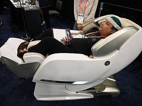 An attendee tries the Bodyfriend Phantom Medical Care massage chair during CES Unveiled ahead of the Consumer Electronics Show (CES) on January 3, 2023 in Las Vegas, Nevada.