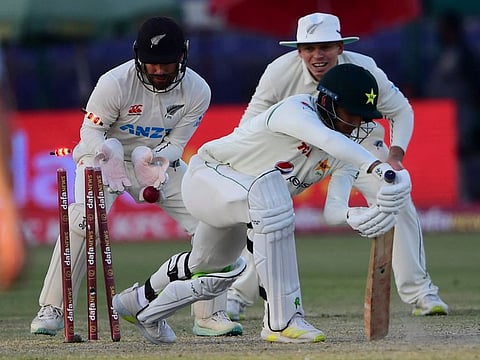 Pakistan's Mir Hamza is clean bowled by New Zealand's Ish Sodhi (not pictured) during the third day of the second cricket Test at the National Stadium in Karachi.