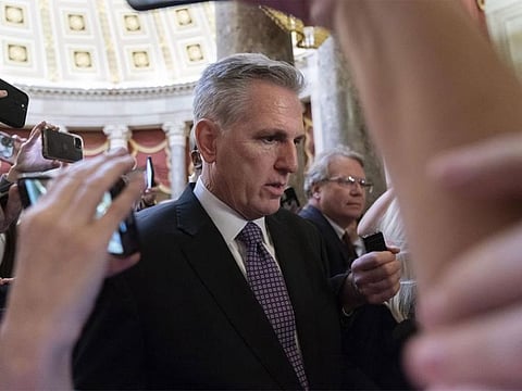 Rep. Kevin McCarthy, R-Calif., is surrounded by reporters as he walks to the House floor from the Speakers Office, Wednesday, Jan. 4, 2023, on Capitol Hill in Washington.