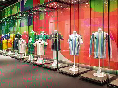 The jerseys on display inside the historic Doha Sports City stadium.