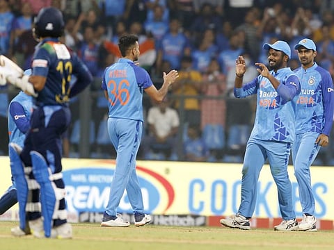 Sanju Samson (second from right) celebrates a dismissal with Harshal Patel during the first T20 match against Sri Lanka in Mumbai on Tuesday.