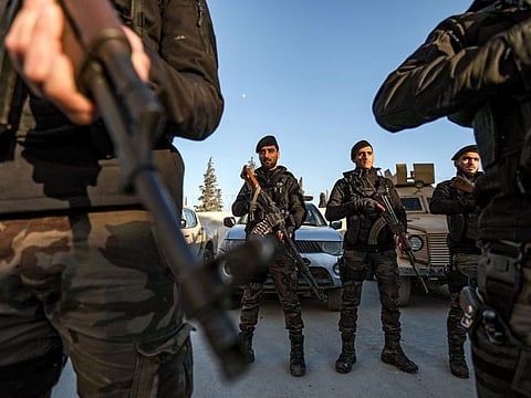 Turkey-backed Syrian fighters stand in formation during a special operations training session in Al Bab in the northern rebel-held part of Syria's Aleppo province on January 3, 2023.