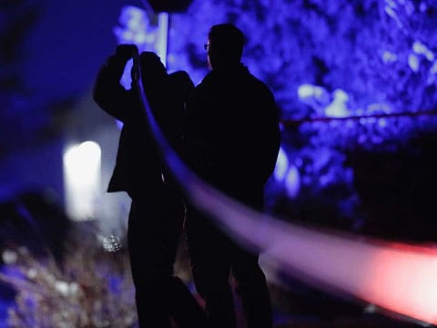 Law enforcement officials stand near the Enoch, Utah, home where eight family members were found dead from gunshot wounds, Wednesday, Jan. 4, 2023.