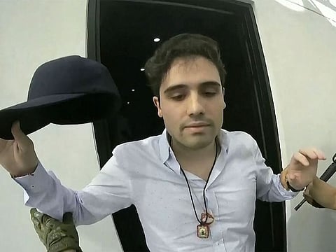 This Oct. 17, 2019 frame grab from video provided by the Mexican government shows Ovidio Guzman Lopez at the moment of his detention, in Culiacan, Mexico