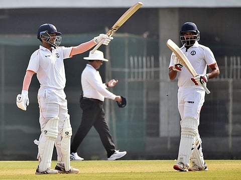 Vidarbha's Harsh Dubey raises his bat after completing his half-century against Jammu and Kashmir during the Ranji Trophy cricket match, at VCA Stadium, in Nagpur on Wednesday, 28th December 2022.