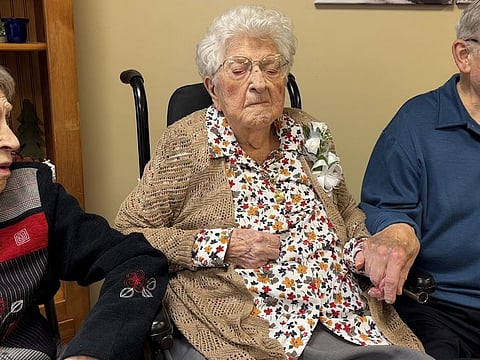 Bessie Laurena Hendricks, centre, celebrating her 115th birthday in November 2022.
