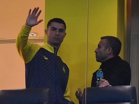 Al Nassr's Portuguese forward Cristiano Ronaldo watches from the VIP area ahead of the Saudi Pro League match against Al Ta'ee at the Mrsool Park Stadium in the Saudi capital Riyadh. He could make his debut on January 22 against Ettifaq.