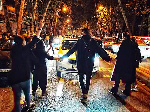 File photo: Women protest the death of 22-year-old woman Mahsa Amini who was detained by the morality police, in Tehran, on Saturday, October 1, 2022.