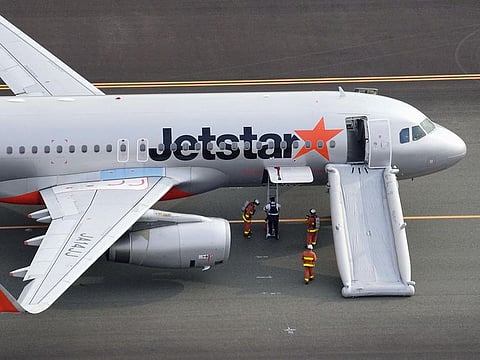 An aerial view shows a Jetstar plane after the budget carrier made an emergency landing following a bomb threat at Chubu Centrair International Airport in Tokoname, central Japan.