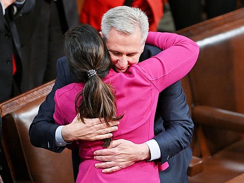 US House Republican Leader Kevin McCarthy hugs House Republican Conference Chair Elise Stefanik as McCarthy celebrates being elected the next Speaker of the US House of Representatives in a late night 15th round of voting in the fourth session of the 118th Congress at the US Capitol in Washington, on  January 7, 2023.