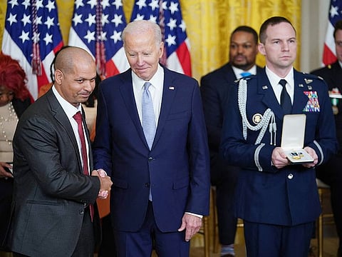 US President Joe Biden awards the Presidential Citizens Medal to former US Capitol Police Sgt. Aquilino Gonell, during a ceremony marking the second anniversary of the January 6, 2021 attack on the US Capitol, in the East Room of the White House in Washington, DC.