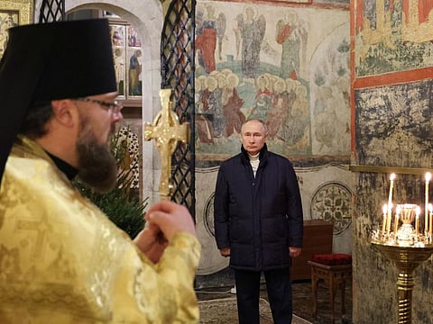 Russian President Vladimir Putin attends the Orthodox Christmas service at the Kremlin in Moscow on January 7, 2023.