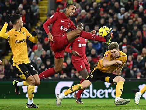 Liverpool's defender Joel Matip attempts to score from a cross in the box during the English FA Cup third round match against Wolverhampton Wanderers at Anfield in Liverpool, north-west England.