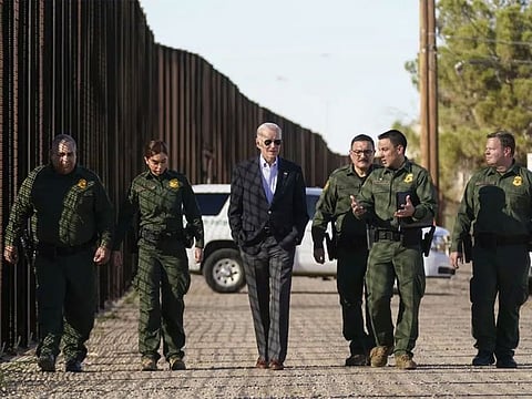 US President Joe Biden walks with Border Patrol agents along a stretch of the border with Mexico Sunday, Januyary 8, 2023, in El Paso, Texas.
