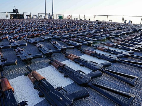 Thousands of AK-47 assault rifles on the flight deck of guided-missile destroyer USS The Sullivans during an inventory process, after they were seized from a fishing vessel in international waters of the Gulf of Oman.