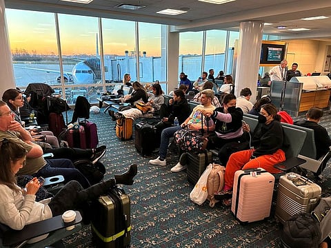 Stranded passengers wait at the Orlando International Airport.