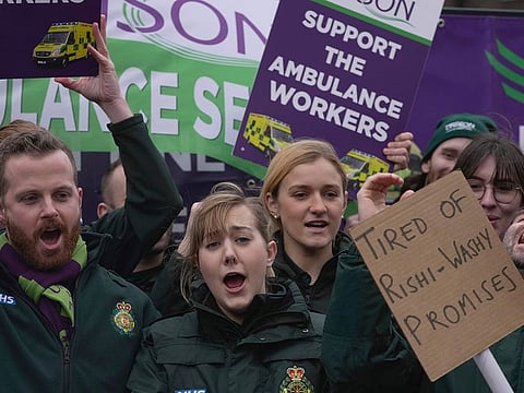 Ambulance workers take part in a strike in London, Wednesday, Jan. 11, 2023.