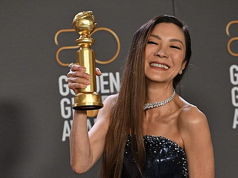 Malaysian actress Michelle Yeoh poses with the award for Best Actress - Motion Picture - Musical/Comedy for "Everything Everywhere All at Once" in the press room during the 80th annual Golden Globe Awards at The Beverly Hilton hotel in Beverly Hills, California, on January 10, 2023. (Photo by Frederic J. Brown / AFP)