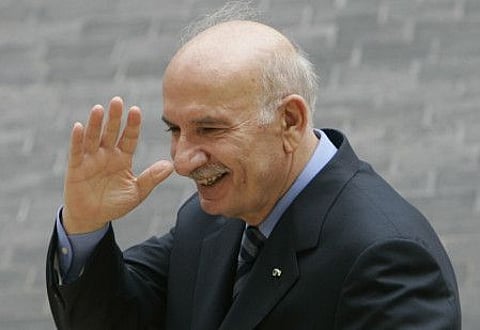 Legislator Hussein Al Husseini, a former parliament speaker waves his hand as he leaves the parliament building after he announced he was quitting his parliamentary seat to protest an Arab-brokered deal that produced a Cabinet of opposing factions, in Beirut, on August 12, 2008.
