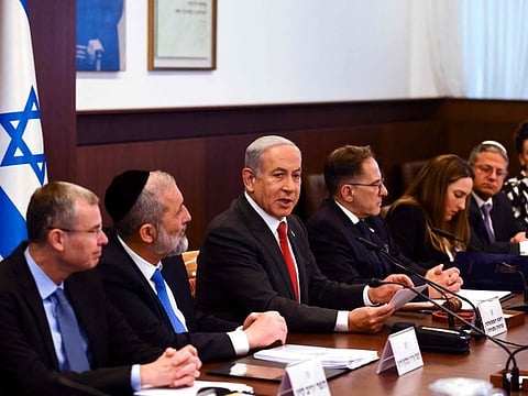 Israel's Prime Minister Benjamin Netanyahu (centre) attends a weekly cabinet meeting at the Prime Minister's office in Jerusalem.