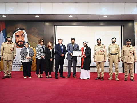 Major General Abdullah Ali Al Ghaithi (fourth from right), Assistant Commander-in-Chief for Operations Affairs in Dubai Police, receiving the degree