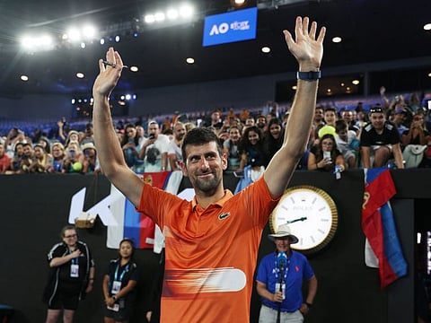 Novak Djokovic waves to fans after the exhibition match against Australia's Nick Kyrgios.