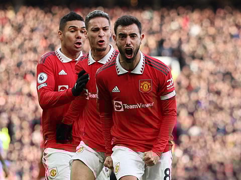 Manchester United's Bruno Fernandes celebrates scoring against Manchester City with Casemiro and Antony during the Premier League clash at Old Trafford, Manchester, England.