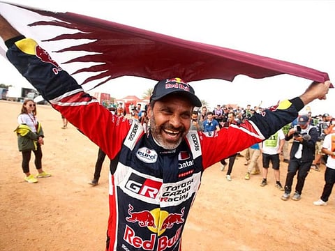 Toyota Gazoo Racing's Nasser Al Attiyah celebrates winning the car category.