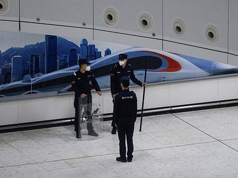 A Chinese police officer stands guard at in the mainland port area of West Kowloon High-Speed Train Station Terminus on the first day of the resumption of rail service to mainland China, during the coronavirus disease (COVID-19) pandemic in Hong Kong, China, January 15, 2023.