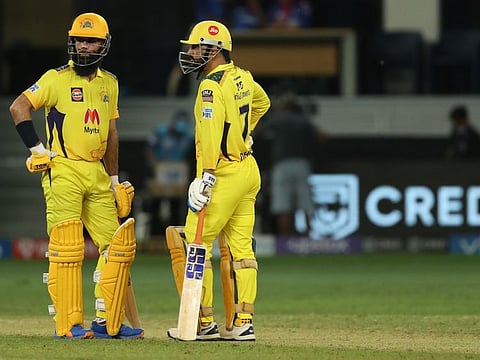 Moeen Ali and MS Dhoni planning during the Indian Premier League Qualifier 1 in Dubai in 2021.
