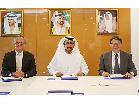 Dr Udo Huenger, Vice President and Head of BASF Market Area Middle East, Ahmad Hamad Bin Fahad, CEO of DUBAL Holding LLC, and Christian Lach, Chief Commercial Officer of Quantafuel ASA, at the signature ceremony of the agreement on the front-end engineering design for a chemical recycling plant in Dubai
