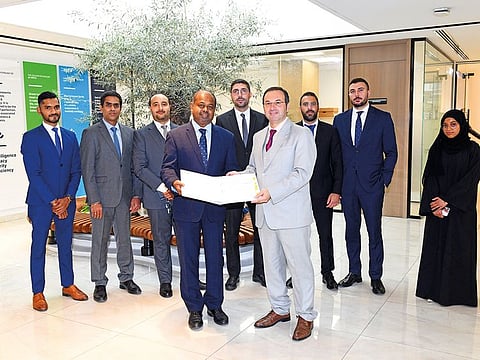 Representatives of EMICOOL and Emirates Electrical Engineering at the signing