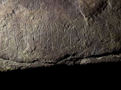 The runestone found at Tyrifjorden, Norway, is shown at the Museum of Cultural History in Oslo, Thursday, Jan. 12, 2023.