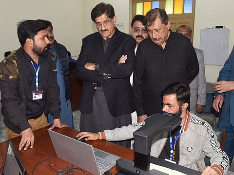 Sindh Chief Minister, Syed Murad Ali Shah, witnesses the process of digitising Sindhi language books.