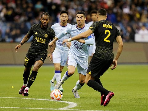 Riyadh All-Stars XI's Cristiano Ronaldo in action with Paris St Germain's Renato Sanches and Achraf Hakimi.