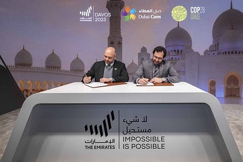 Dr Tariq Al Gurg, CEO and vice-chairman of Dubai Cares (right) during the signing ceremony at Davos to host the second edition of RewirEd Summit, a global education cooperation platform, during COP28 in Dubai