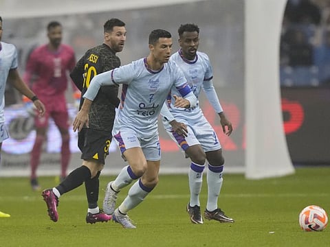 Cristiano Ronaldo (right) playing for All-Star team against PSG's Lionel Messi during a friendly at King Saud University Stadium in Riyadh on Thursday.