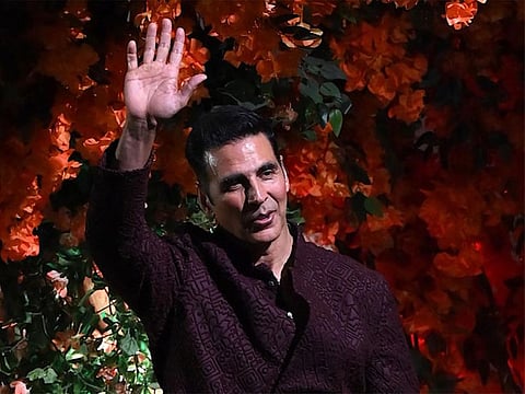 Bollywood actor Akshay Kumar poses upon his arrival to attend the engagement ceremony of Anant Ambani, the son of Indian billionaire Mukesh Ambani, in Mumbai on January 19, 2023. (Photo by SUJIT JAISWAL / AFP)
