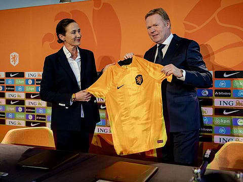 Netherlands' coach Ronald Koeman (right) receives a jersey from KNVB director of professional football Marianne van Leeuwen during a press conference at the KNVB Campus training centre in Zeist. Koeman has returned to coach the Dutch national team for a second time, succeeding to Louis van Gaal.