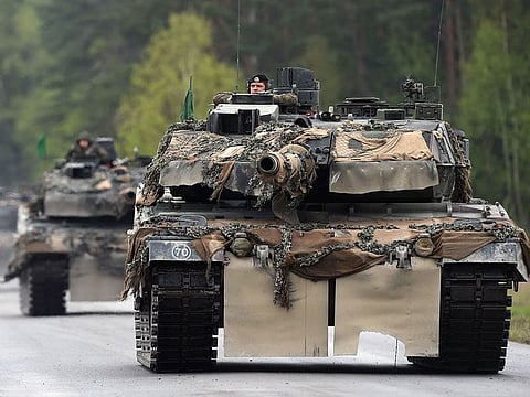 This file photo taken on May 12, 2017 shows German soldiers on Leopard tanks